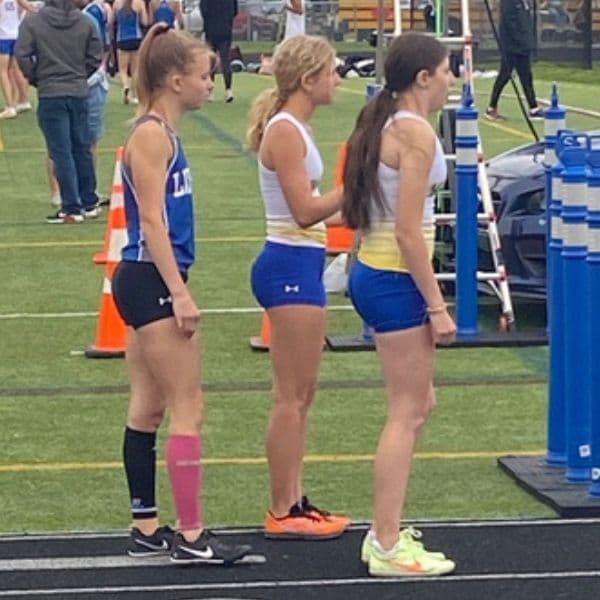 RFP athletes Lauren and Lanie lined up at the start of the 1600M at an Olentangy track meet