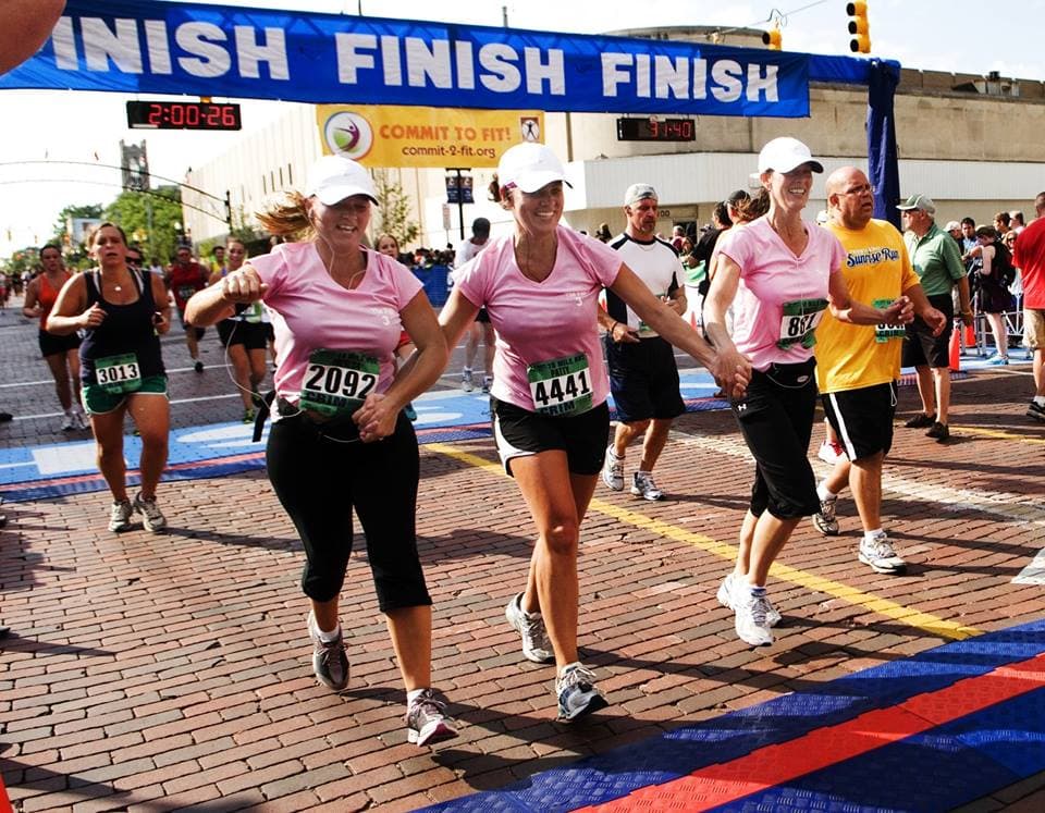 Run For Performance athlete celebrating a race goal